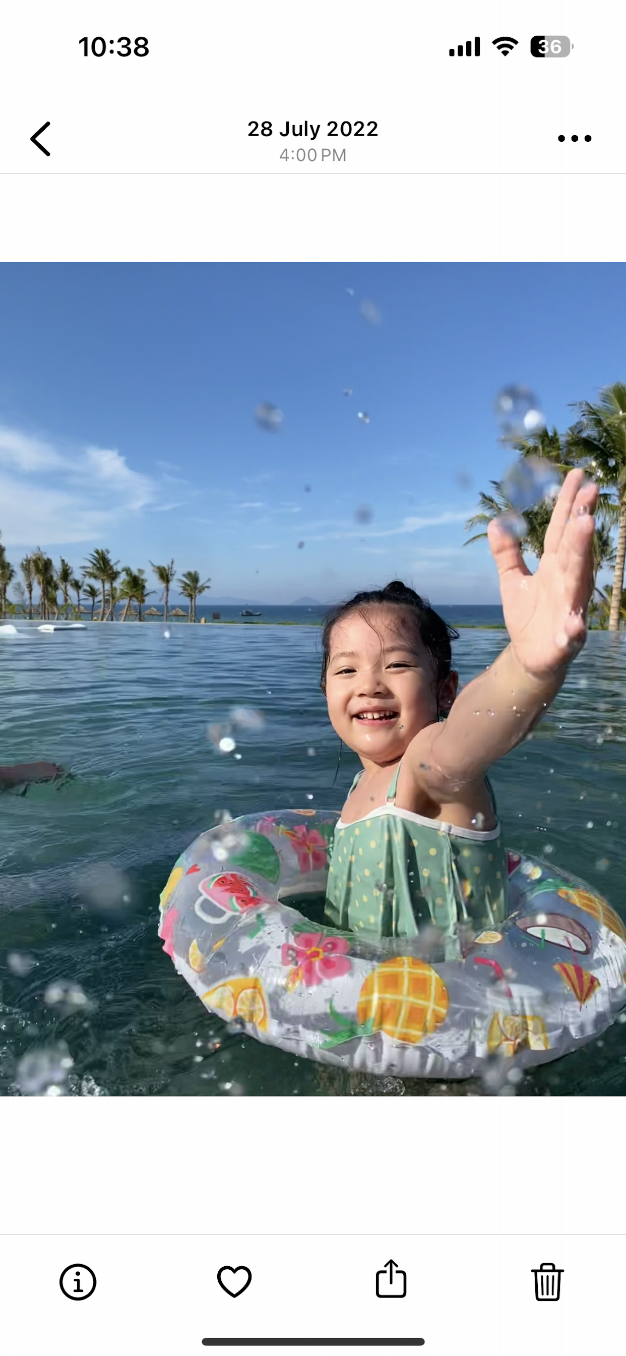Photo viewer with info, favorite, share, and delete actions